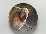Platter, anagama natural ash glaze with kaolin flashing slip and white and black trailing decoration