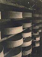 André Kertész - Cheese Racks, Paris (Photographs) h: 9.5 x w: 7.1 in / h: 24.1 x w: 18 cm