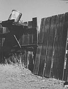 Wright Morris - Fence and Garbage Pail, Pomona (Photographs) h: 9.4 x w: 7.5 in / h: 23.9 x w: 19 cm