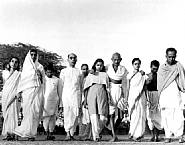 Margaret Bourke-White - Gandhi walking with close advisors and family members, India (Photographs) h: 16 x w: 20 in / h: 40.6 x w: 50.8 cm