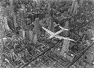 Margaret Bourke-White - A DC-4 Flying Over New York City (Photographs) h: 20 x w: 24 in / h: 50.8 x w: 61 cm