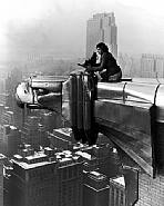 Margaret Bourke-White - Margaret Bourke-White working atop the Chrysler Building, New York, NY; photographed by her assistant, Oscar Graubner (Photographs) h: 16 x w: 20 in / h: 40.6 x w: 50.8 cm