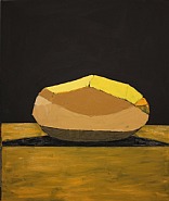 A Carefully Peeled Golden Wonder Against a Dark Background