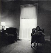 Diane Arbus - Lady in a Rooming House Parlor, Albion, NY, 1963