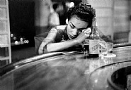 Eve Arnold - Bar girl in a brothel in the red light district, Havana, Cuba, 1954