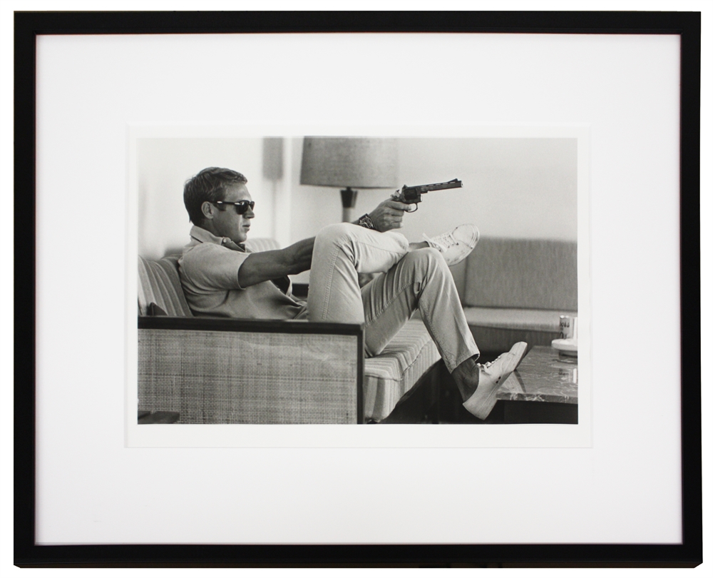 Steve McQueen aims a pistol in his living room, California by John ...