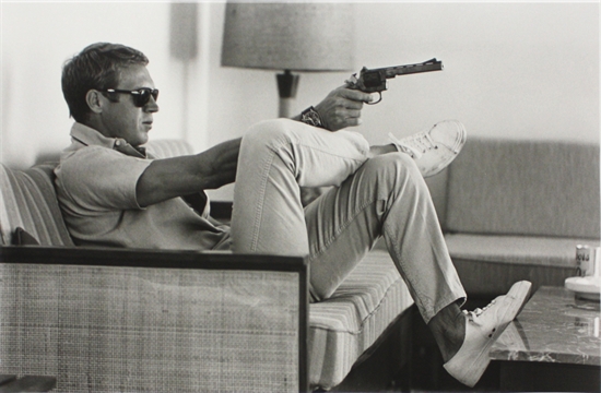 Steve McQueen aims a pistol in his living room, California by John ...
