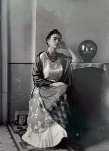 Frida Kahlo with globe in Bravo's studio by Manuel Álvarez Bravo