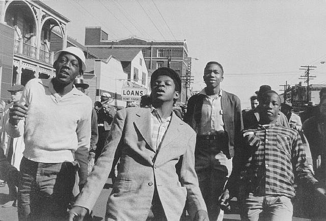 'Second-Liners' Following Brass Band. New Orleans, Louisiana