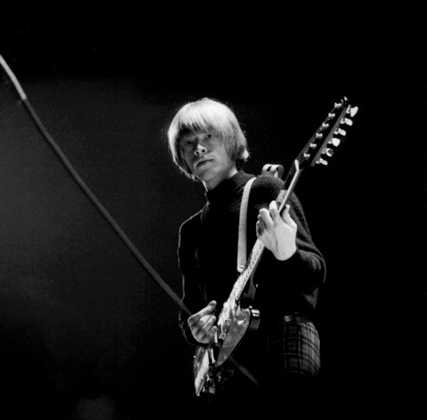 Brian with Guitar. On Stage U.S.A. Brian was still in pretty good shape at this time and made an enormous contribution to the success of the band. His image was the most defined of all of them and he had a huge following of devoted fans.