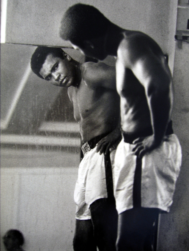 Muhammad Ali looking in the mirror while training at 5th Street Gym.Miami Beach, FL, October 9